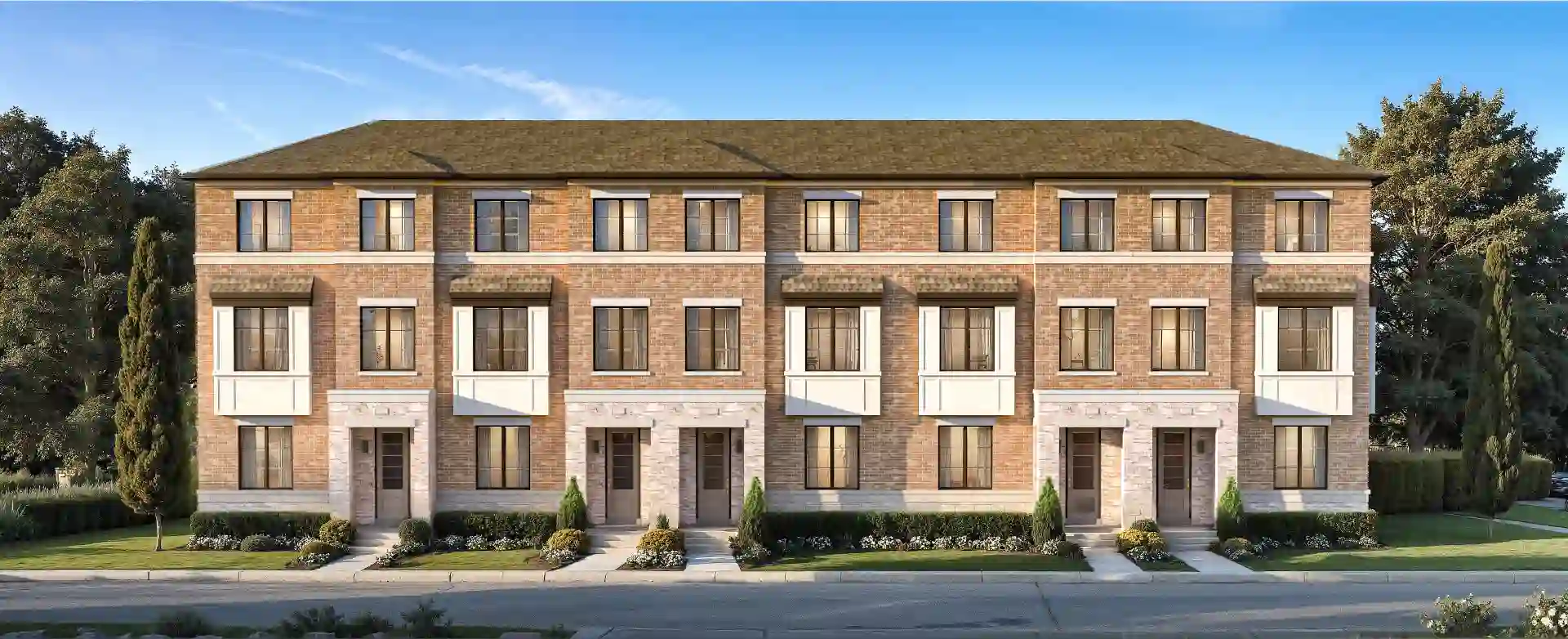 Front elevation of an Elements Milton townhome block in brick and stone